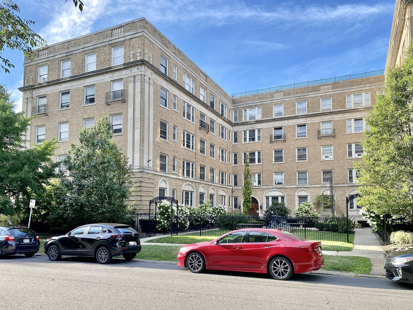 Tan brick apartments along the street